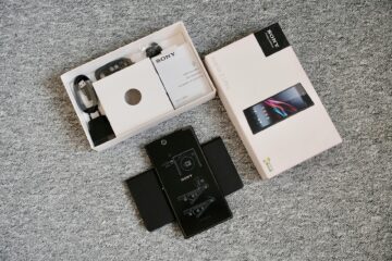 Detailed unboxing image of a mobile phone and its accessories, perfect for tech blogs. (Photo by Phong Thanh on Pexels)