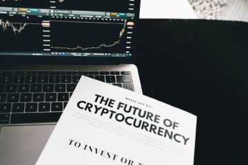 A detailed look at cryptocurrency market trends using a laptop and analytical document. (Photo by Alesia  Kozik on Pexels)