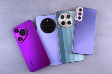 Array of colorful modern smartphones displayed on a grey surface. (Photo by Andrey Matveev on Pexels)