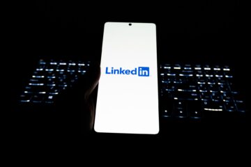Close-up of LinkedIn logo on smartphone with backlit keyboard in dark room. (Photo by Zulfugar Karimov on Pexels)